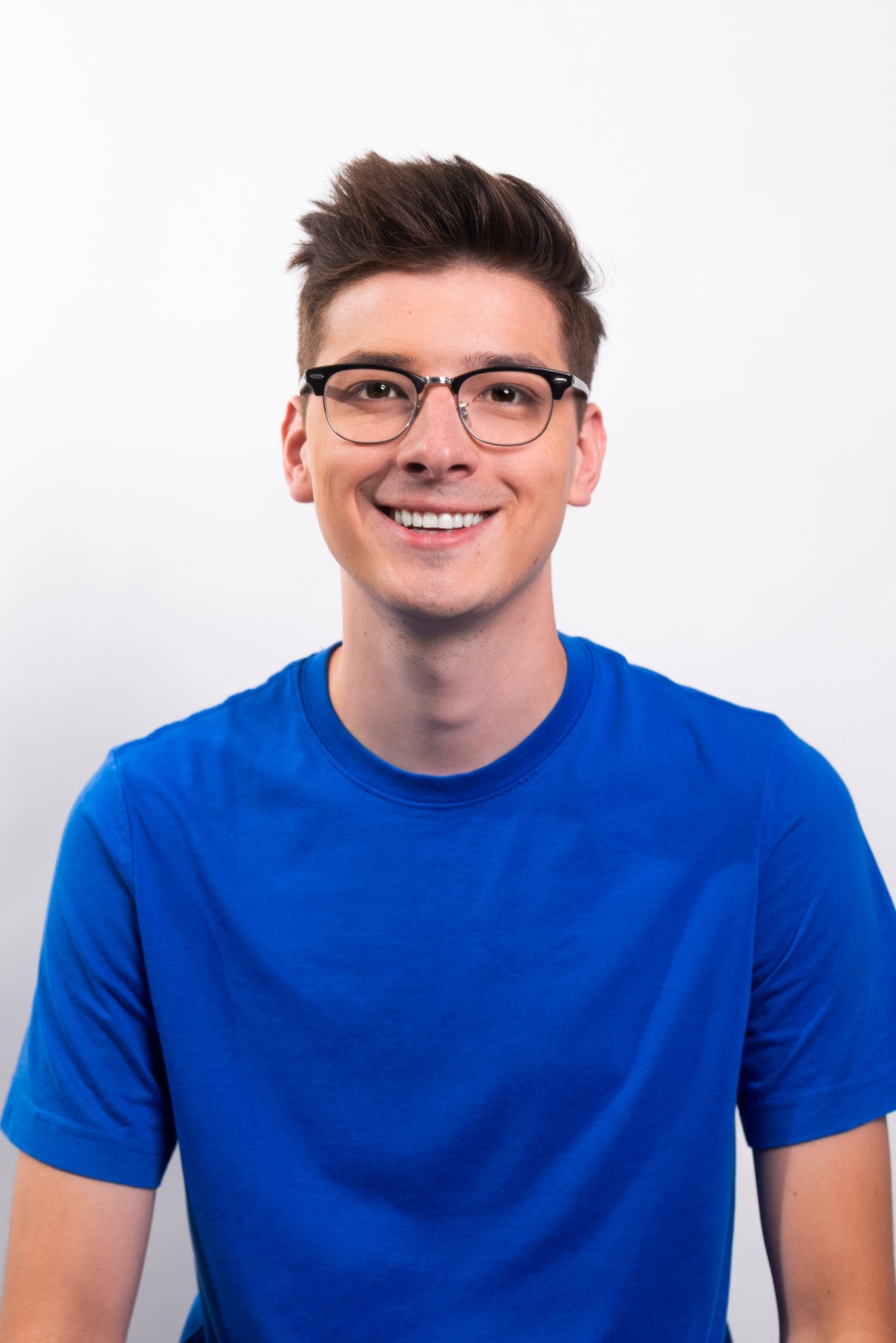 Hew Moran smiling in a blue shirt